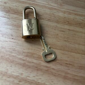 Louis Vuitton brass lock with key, #304